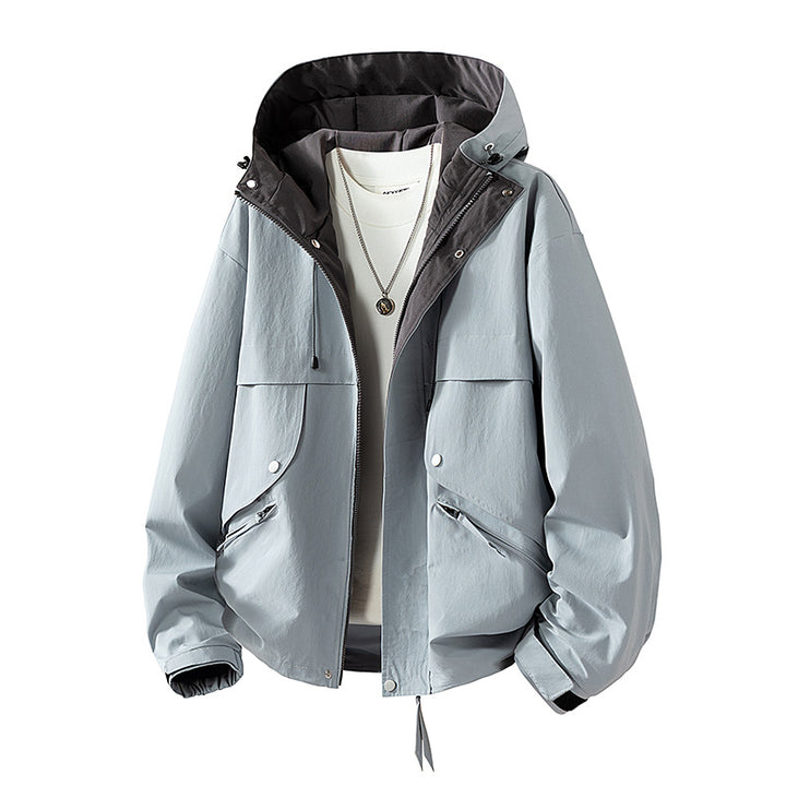 Unisex lightweight windproof transitional jacket with adjustable hood, drawstring, and zippered pockets Mune Fashion