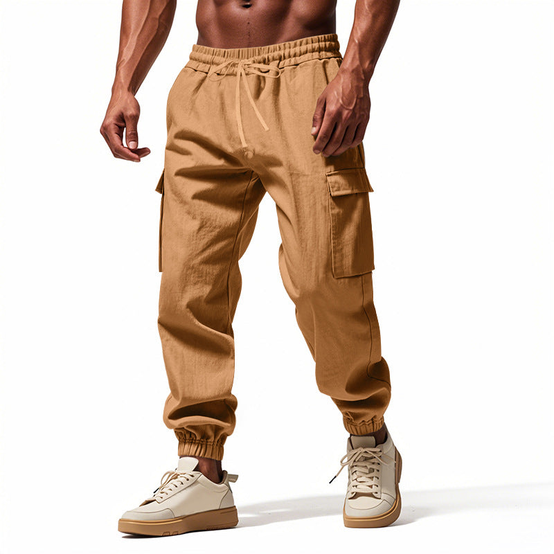 Men's tapered joggers in utilitarian style with elastic waistband, drawstring, and flap pockets Mune Fashion