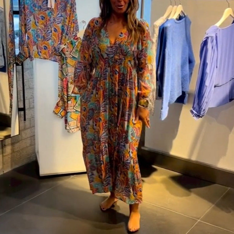 Women's tiered maxi dress in boho style with paisley print, V-neck, gathered empire waist and elastic cuffs Mune Fashion