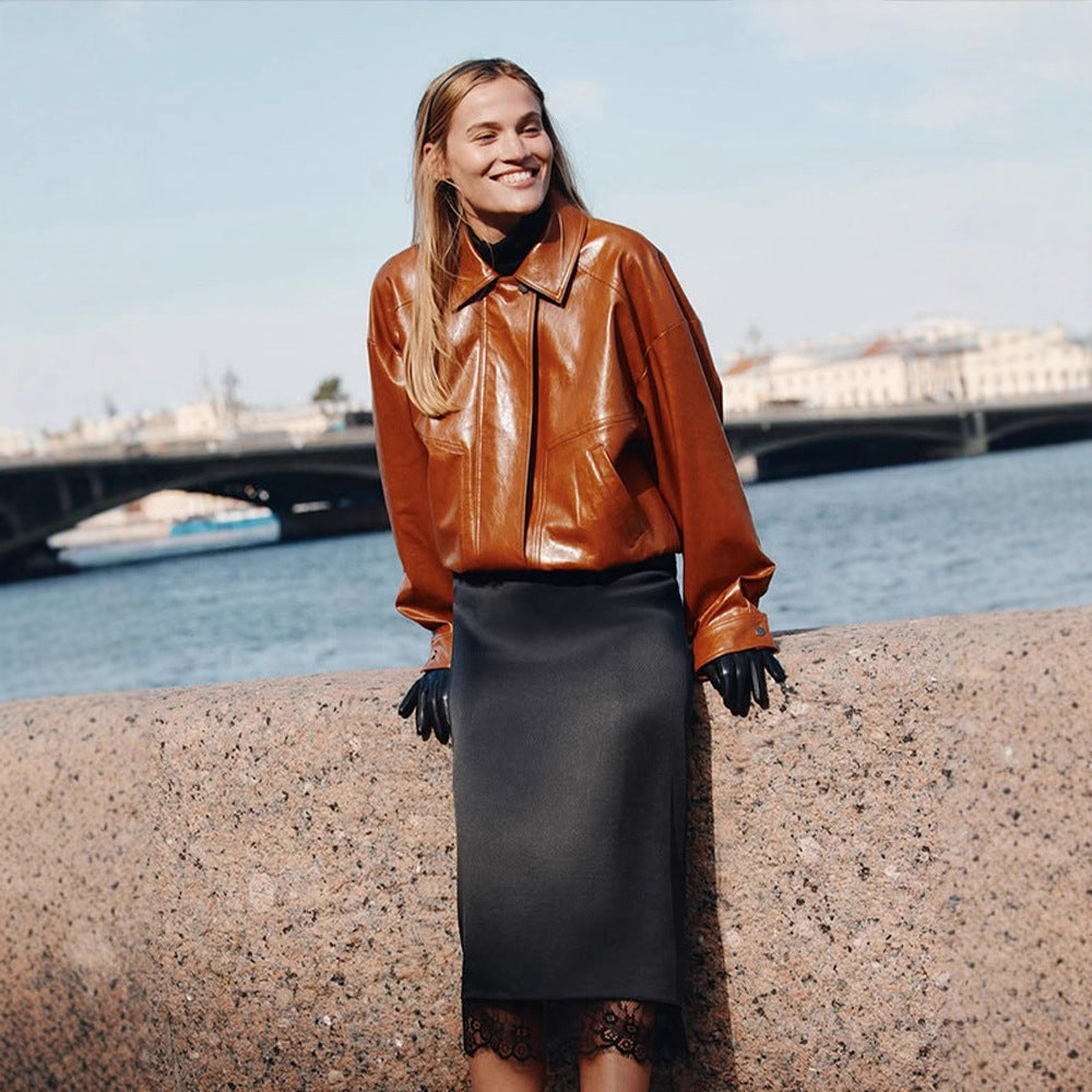 Women's short blazer made of vegan smooth leather with boxy silhouette and concealed snap button placket Mune Fashion
