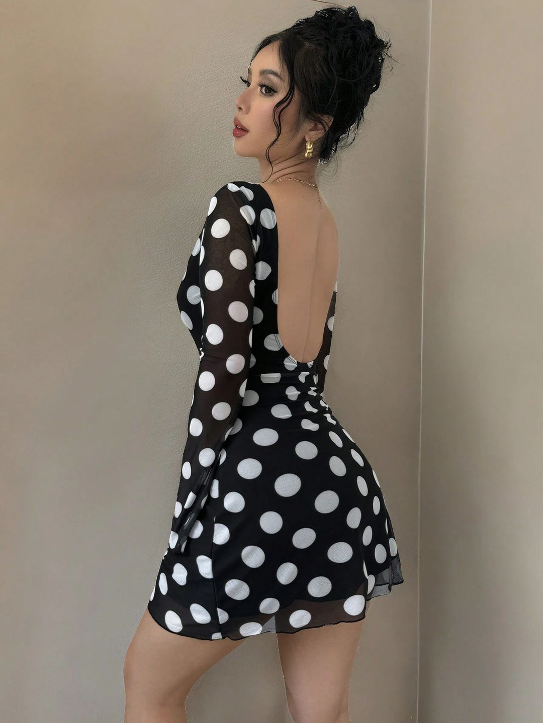 Women's figure-hugging transparent mesh mini dress with deep back neckline and polka dot pattern Mune Fashion