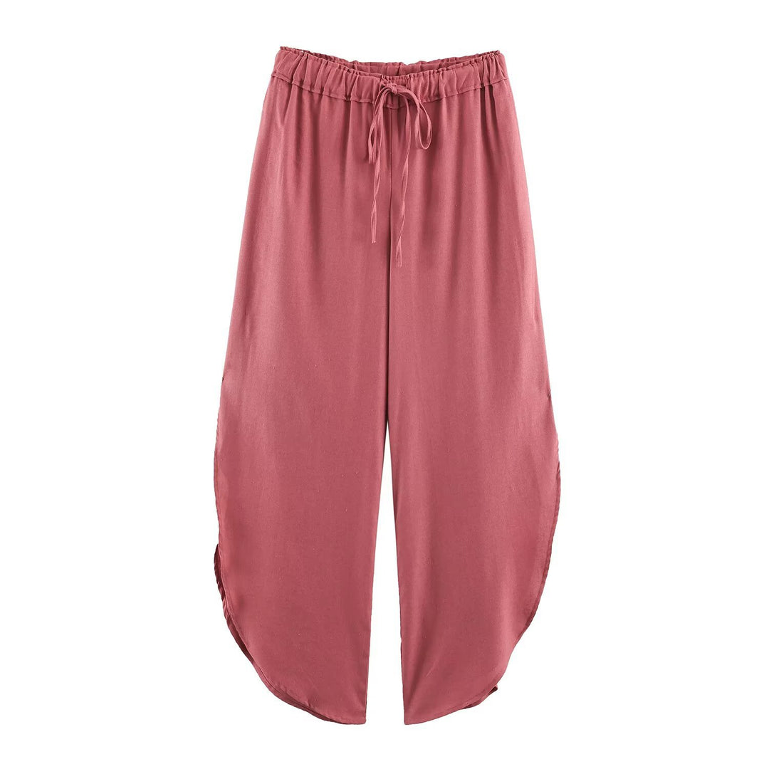Ladies loose-fitting harem pants with drawstring waistband, mid-slit, and rounded hem Mune Fashion
