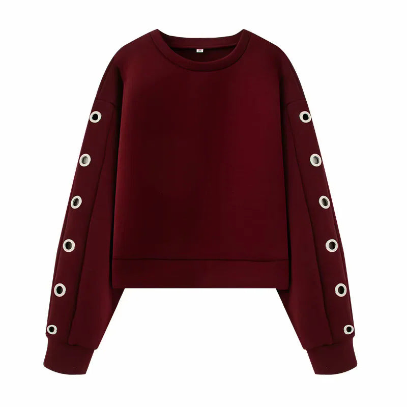 Women's oversized sweatshirt with decorative metal eyelets on the sleeves Mune Fashion