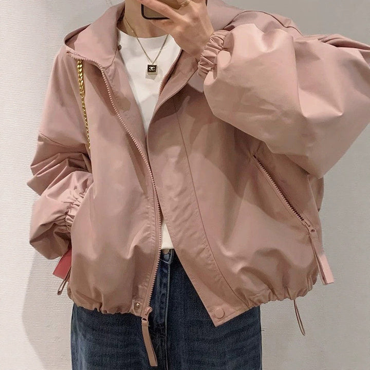 Women's oversized bomber-style hooded jacket with drawstring, elastic cuffs, and side zip pockets Mune Fashion
