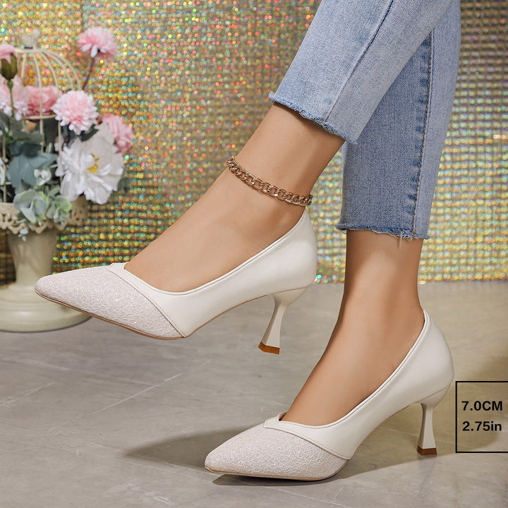 Women's pointed pumps with structured toe cap, curved stiletto heel, and cushioned comfort insole Mune Fashion