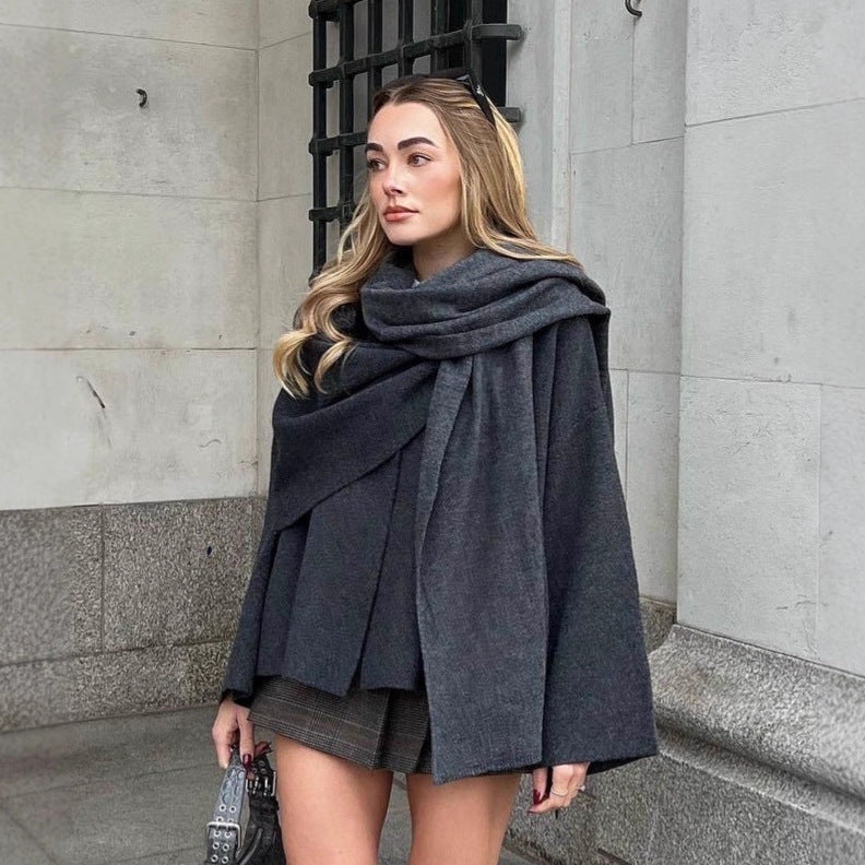 Ladies two-layer knit poncho with asymmetric hem and decorative button collar Mune Fashion