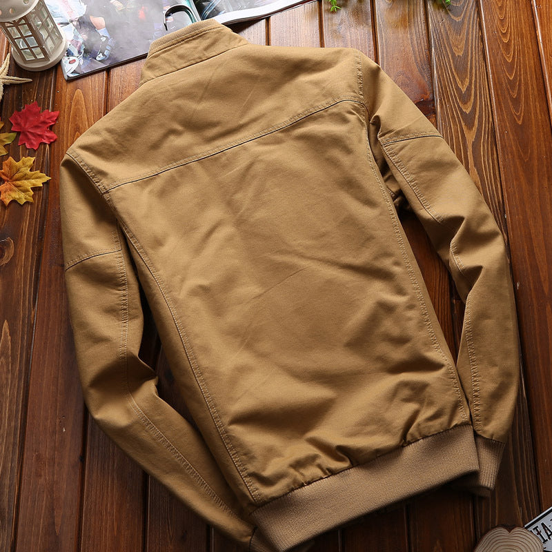 Men's lightweight canvas utility jacket with quilted lining, concealed two-way zipper, and elastic cuffs.