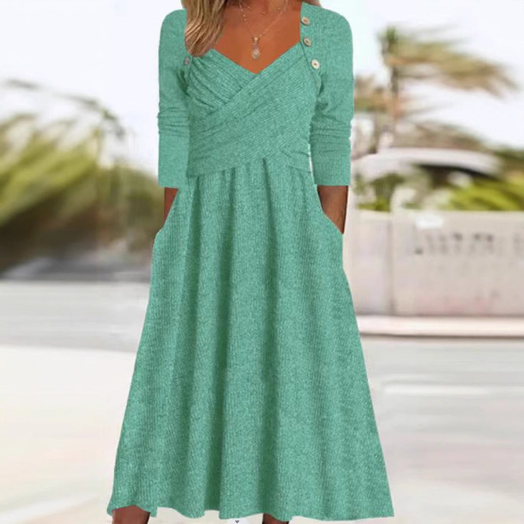 Women's knitted maxi dress with wrap top V-neck, side pockets and decorative button placket Mune Fashion