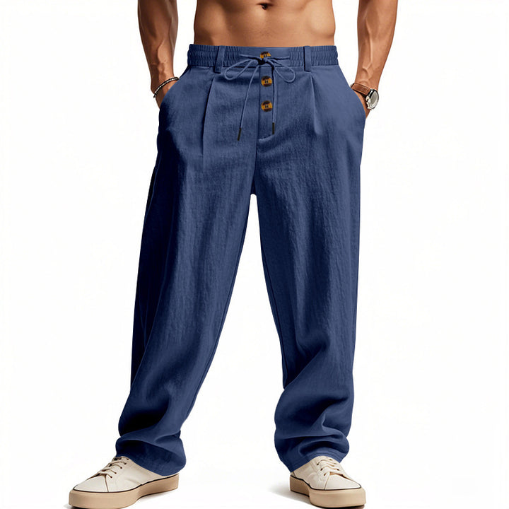 Men's casual pleated pants in linen look with elastic tunnel drawstring, decorative button placket, and deep side pockets Mune Fashion
