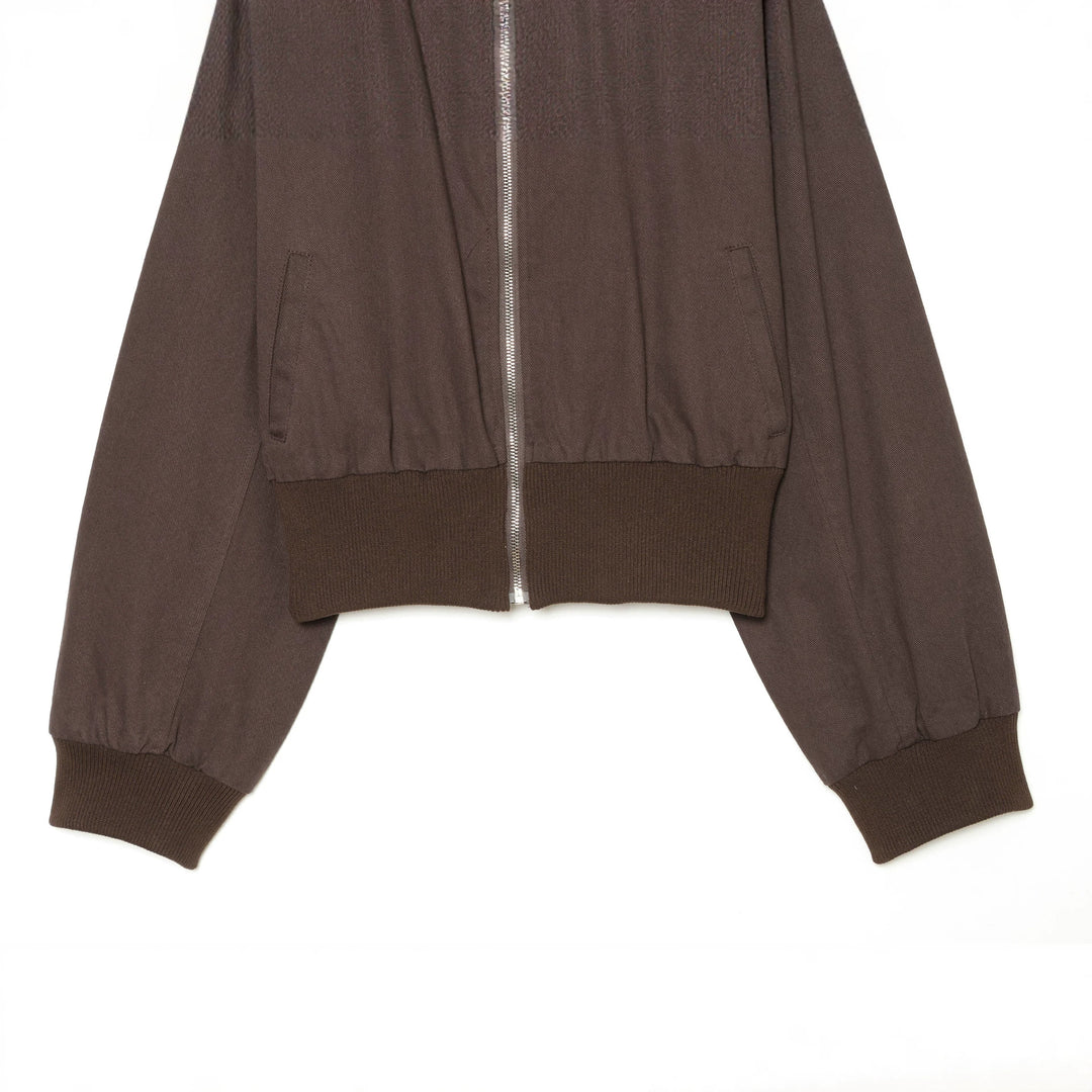 Women's cropped bomber jacket with wide ribbed waistband, metal zipper, and oversized sleeves Mune Fashion