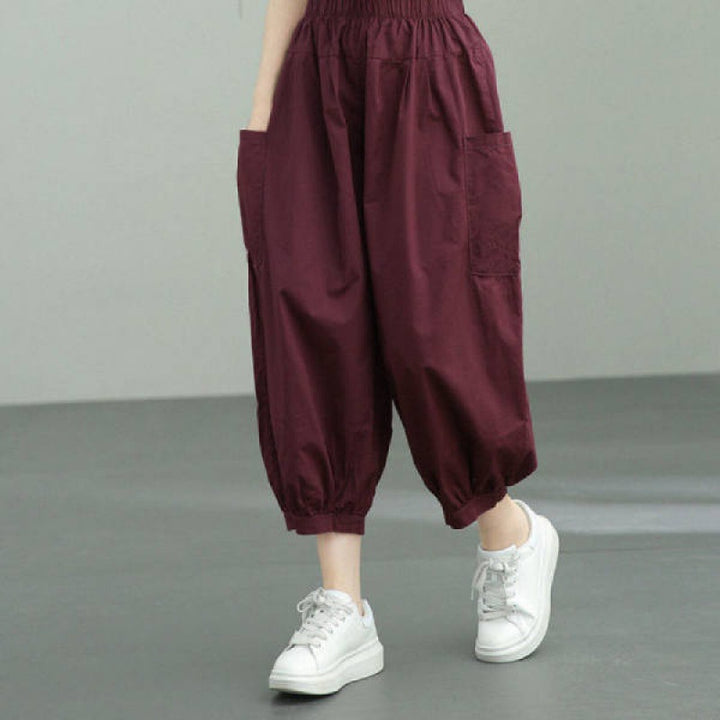 Women's wide harem pants with elastic waistband and applied side pockets Mune Fashion