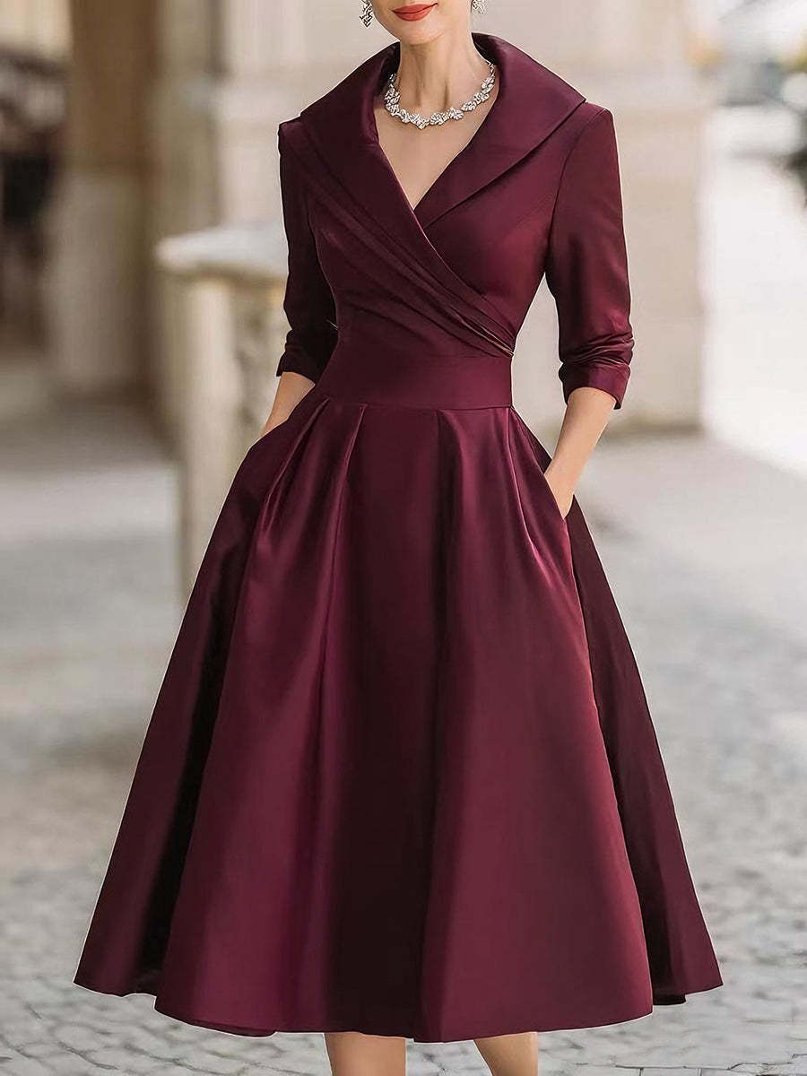 Women's elegant midi dress with wrap top, three-quarter sleeves, and side pockets Mune Fashion