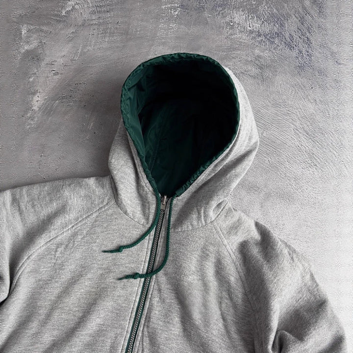 Unisex non-fitted windbreaker with hood padded fleece lining drawstring hem and decorative stripes on sleeves Mune Fashion