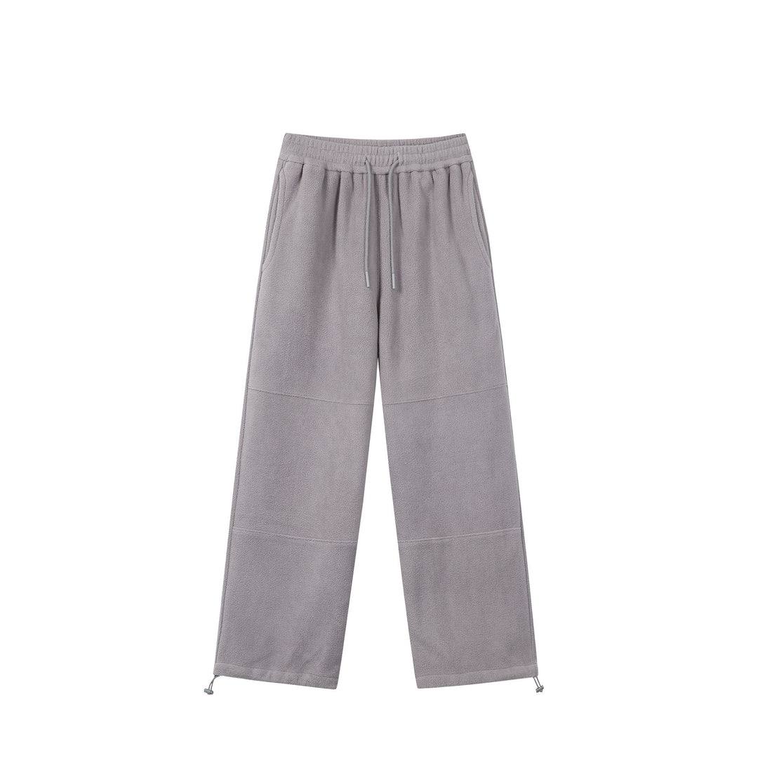 Women's wide fleece jogging pants with drawstring waistband, side pockets, and adjustable hem.