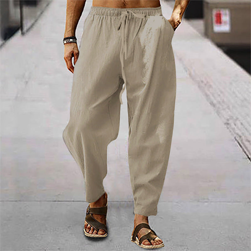 Men's lightweight harem pants in linen look with elastic drawstring waistband, side pockets, and tapered ankle cuffs Mune Fashion