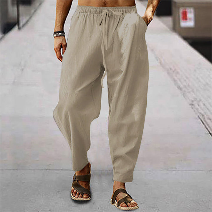 Men's lightweight harem pants in linen look with elastic drawstring waistband, side pockets, and tapered ankle cuffs Mune Fashion