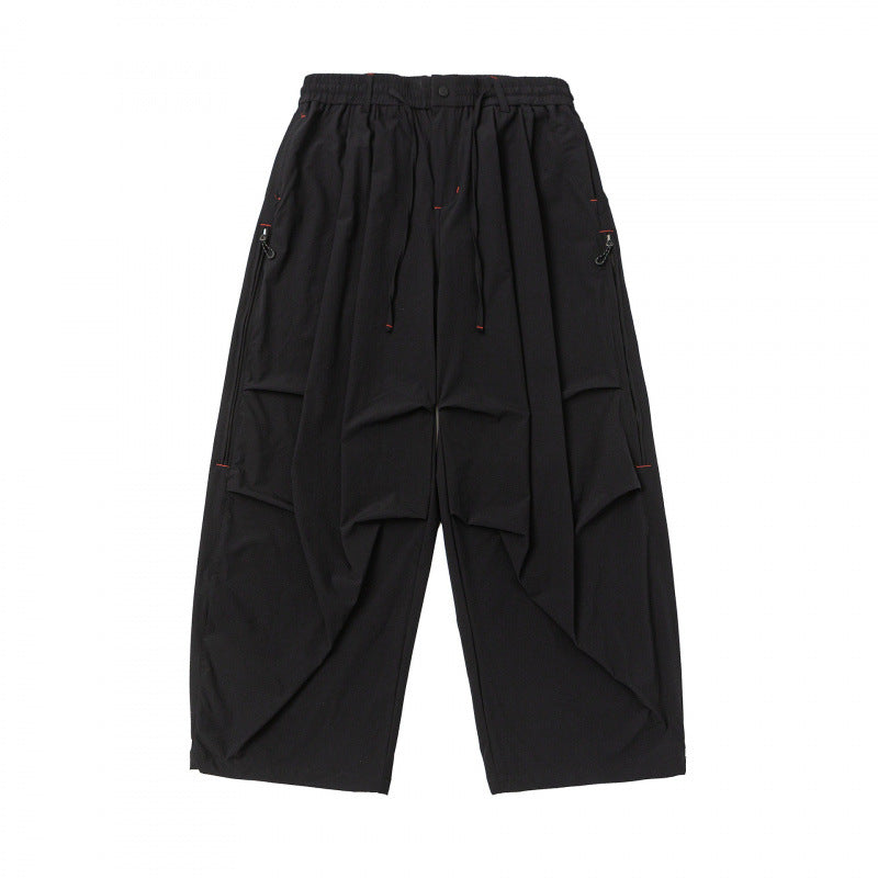 Unisex Loose-fitting technical cargo pants with elastic waistband, drawstring, and zip pockets Mune Fashion