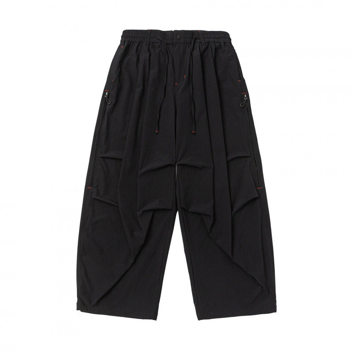 Unisex Loose-fitting technical cargo pants with elastic waistband, drawstring, and zip pockets Mune Fashion