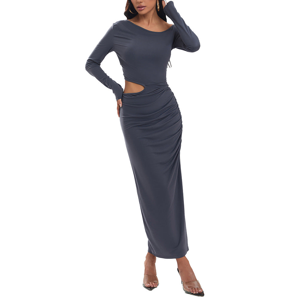 Women's a fitted maxi dress with long sleeves, side cut-out, gathered hip, and high leg slit.