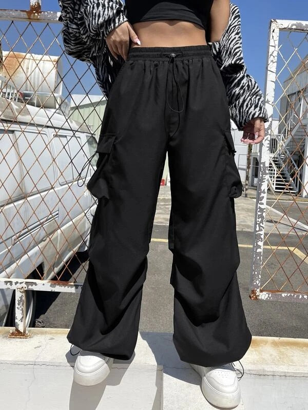 Women’s wide cargo pants with drawstring waist, multiple pockets, and adjustable hem Mune Fashion