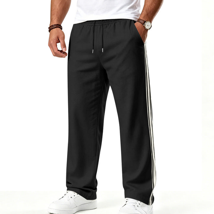 Men's loose-fitting training pants with double side stripes and elastic waistband Mune Fashion