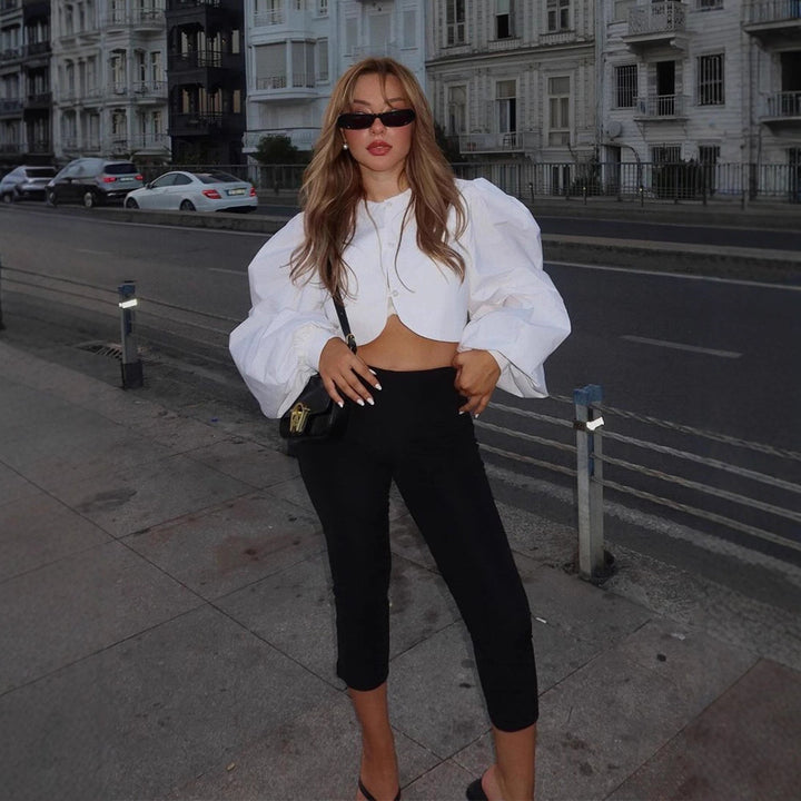 Women short-cut blouse with curved hem edge and voluminous puff sleeves Mune Fashion