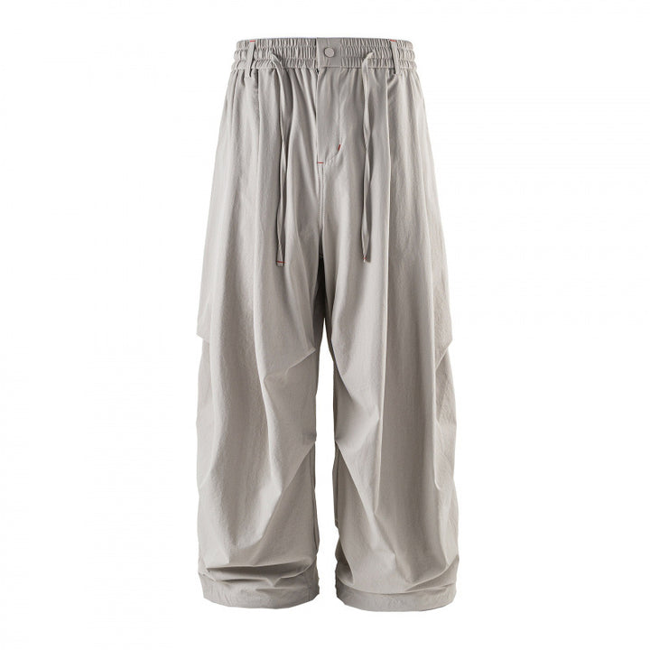 Unisex Loose-fitting technical cargo pants with elastic waistband, drawstring, and zip pockets Mune Fashion