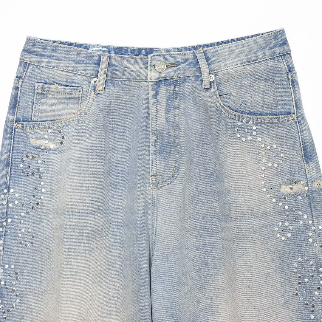 Women's jeans with a high waist, wide leg, rhinestone trim, and destroyed details Mune Fashion