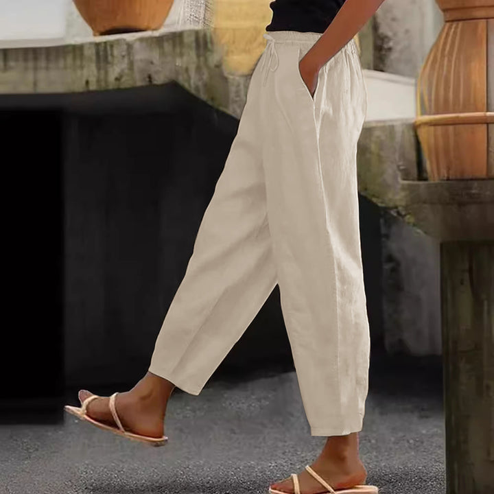Women's loose-fitting linen blend pants with elastic waistband, drawstring, and angled side pockets Mune Fashion
