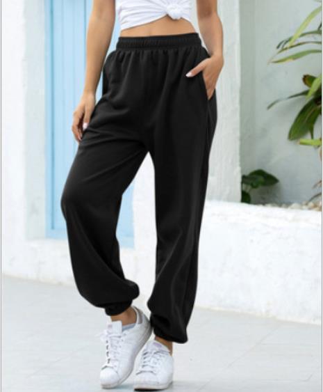 Women's wide High-Waist jogging pants made of soft fleece with elastic waistband, side pockets, and narrow cuffs Mune Fashion