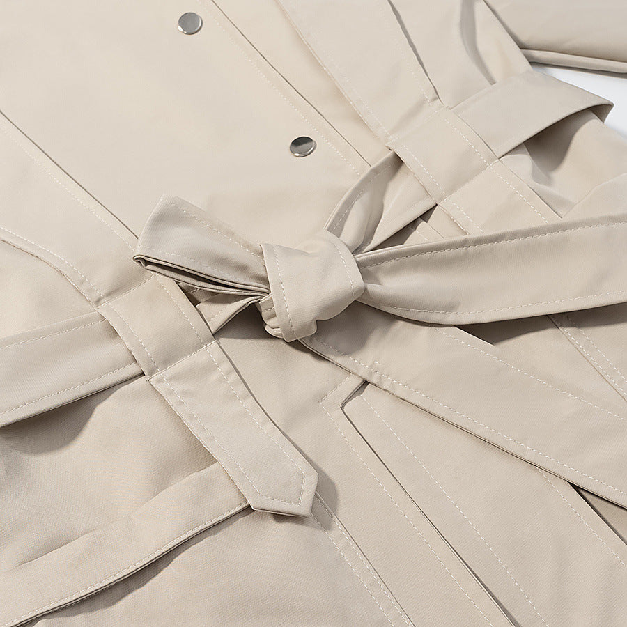 Ladies short trench coat with cape detail, stand-up collar and tie belt Mune Fashion