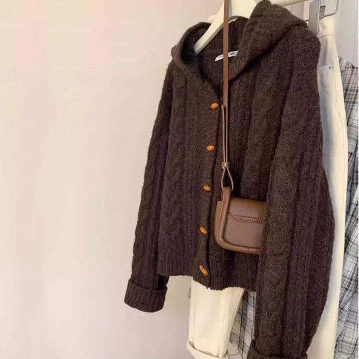 Women's hooded cardigan with cable knit, wooden button placket, and boxy silhouette Mune Fashion