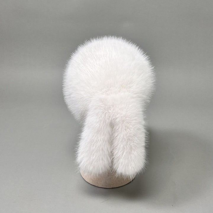 Women’s plush faux fur trapper hat with earflaps and decorative tail Mune Fashion