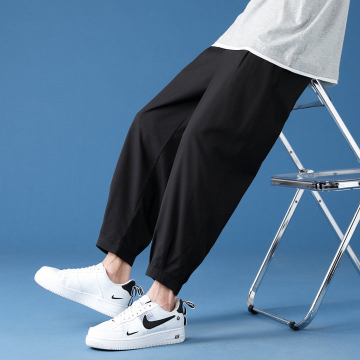 Men's wide technical jogging pants with elastic waistband, gathered leg cuffs, and breathable stretch material Mune Fashion