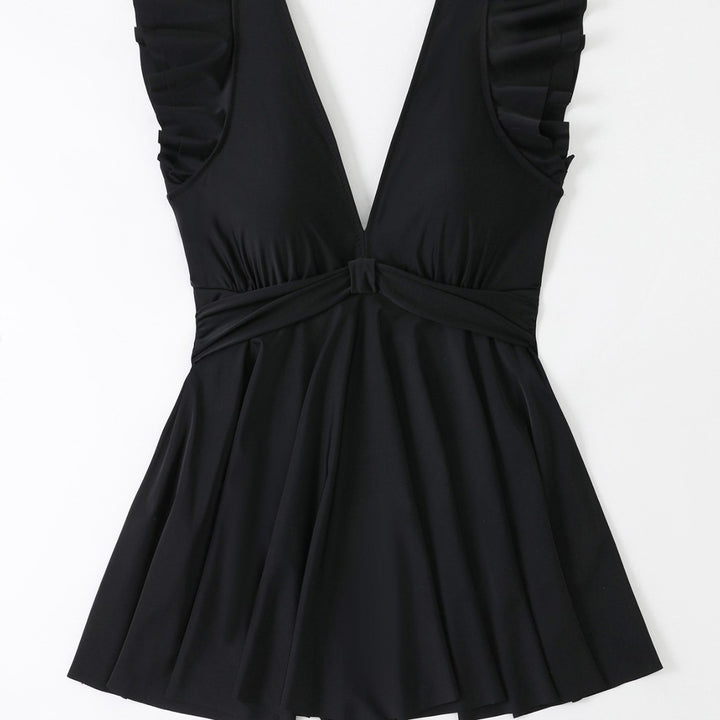 Women's beach dress with a light V-neck and voluminous ruffle details Mune Fashion