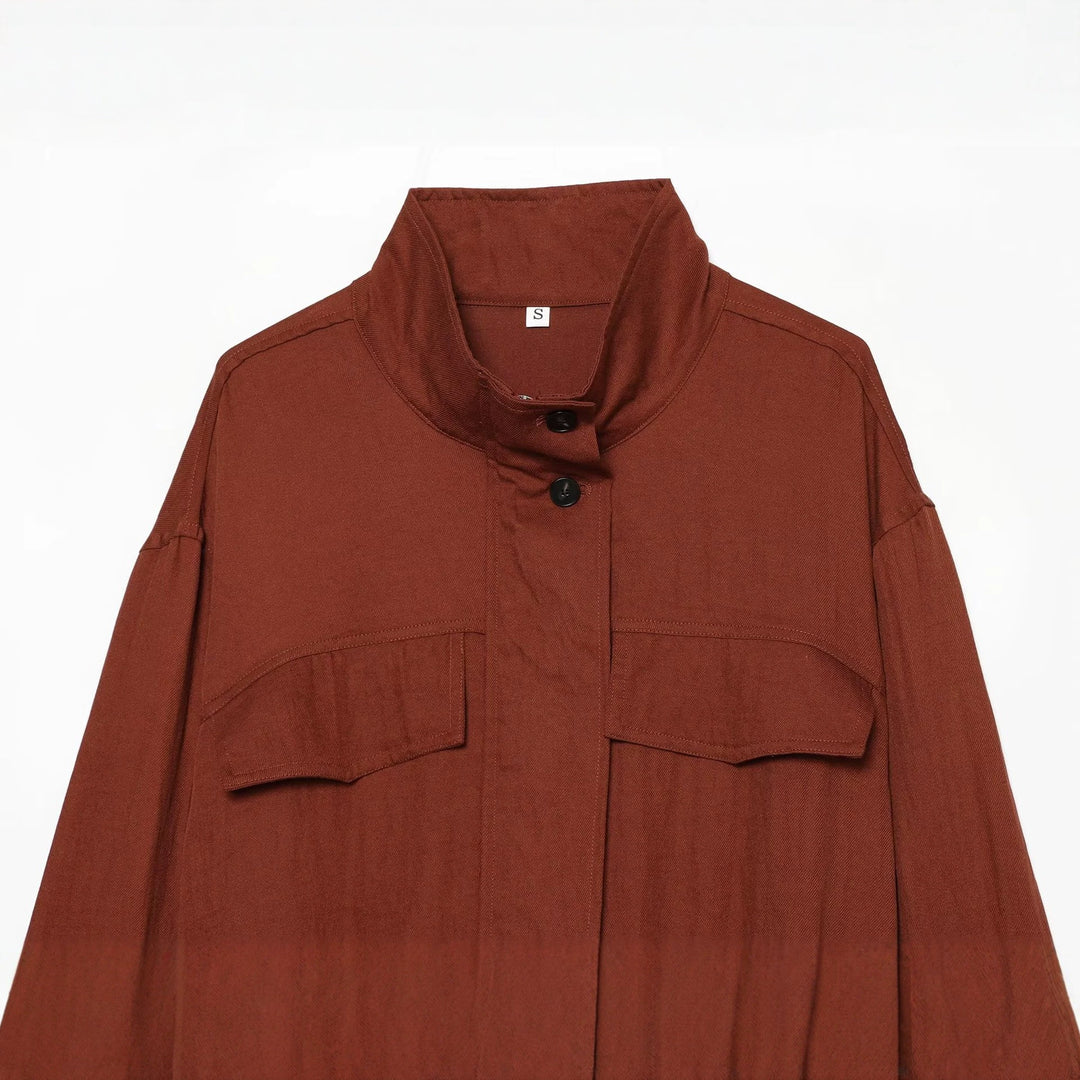 Women's short jacket in utility style with stand-up collar, patch chest pockets, and drawstring hem Mune Fashion