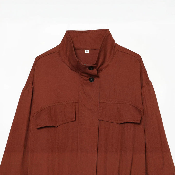 Women's short jacket in utility style with stand-up collar, patch chest pockets, and drawstring hem Mune Fashion