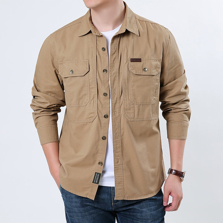Men's casual utility shirt jacket made of cotton twill with two patch breast pockets and buttonable front.