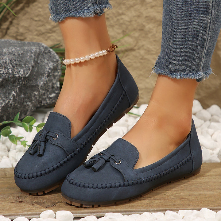 Ladies  classic moccasin slippers with tassels, hand-stitched frame seam and non-slip rubber sole Mune Fashion