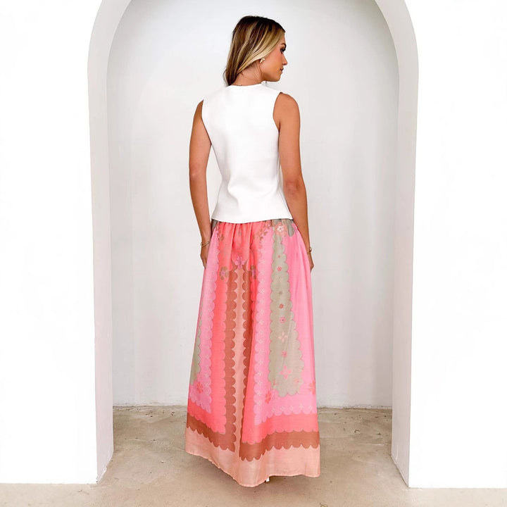 Women's flowing maxi skirt with V-shaped yoke, narrow drawstring waist and printed scallop pattern Mune Fashion