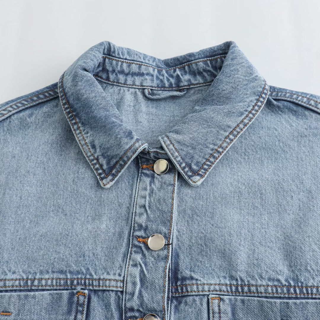 Women's cropped oversized jeans jacket with drawstring hem, patch chest pockets, and metal button placket Mune Fashion