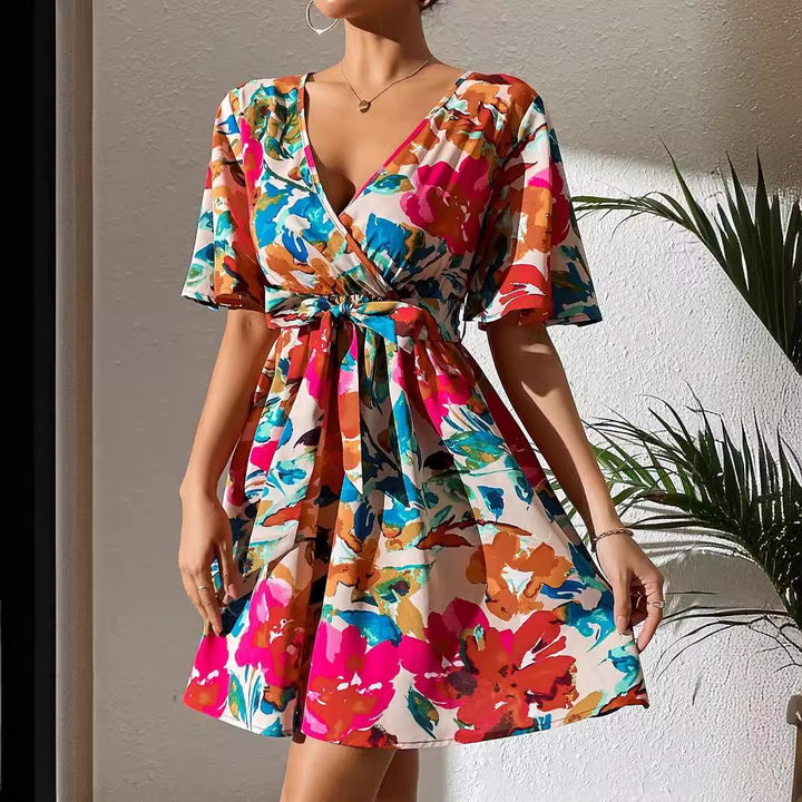 Women's wrap mini dress with deep V-neck, waist lacing, and wide trumpet sleeves Mune Fashion