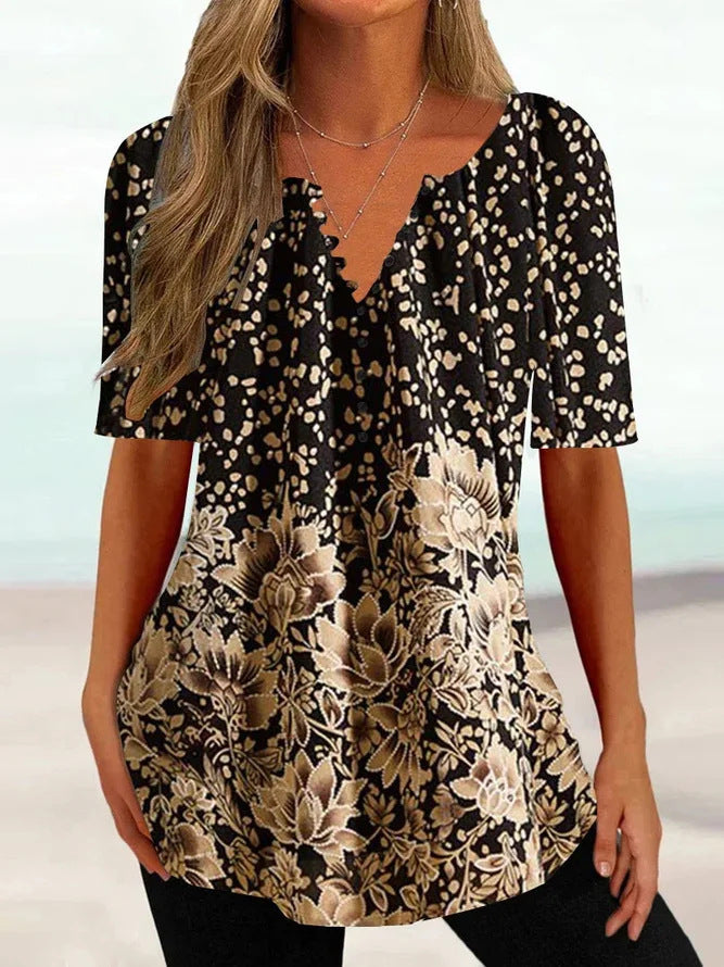 Women’s loose V-neck tunic top with floral trim and polka dot pattern Mune Fashion