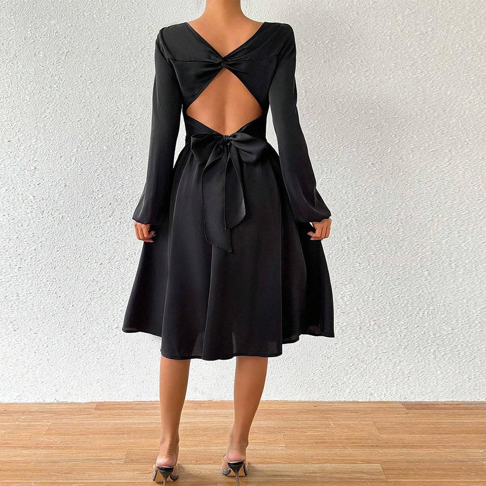 Women's elegant midi dress with tailored corset look, flared A-line skirt, and long flared sleeves Mune Fashion
