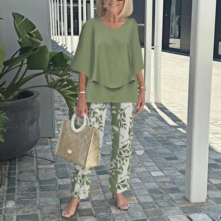 Women's layered tunic with cape sleeves and ankle-length straight leg pants with graphic print Mune Fashion