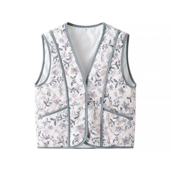 Women's light quilted vest with floral print, V-neck and side pockets Mune Fashion