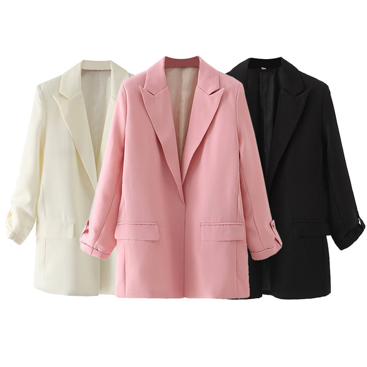 Women oversized blazer with wide lapels, flap pockets, and roll-up sleeves Mune Fashion