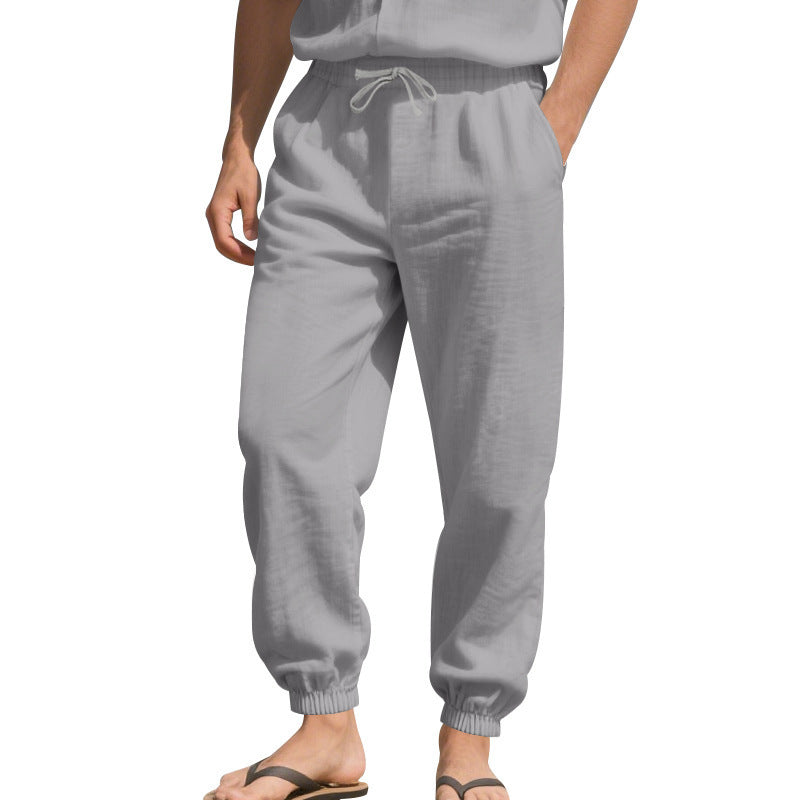 Men's light linen pants with elastic tunnel drawstring waistband, side pockets, and smocked cuffs Mune Fashion