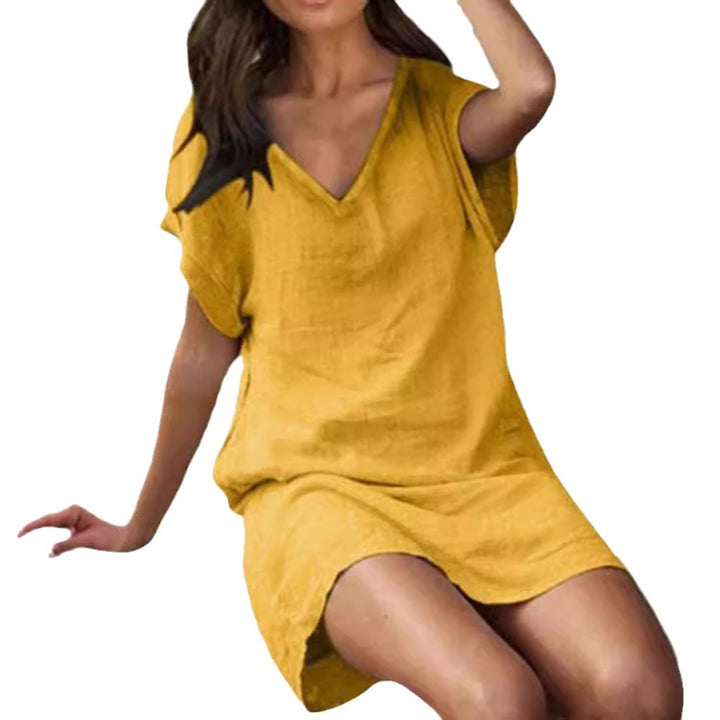 Women's V-neck tunic dress with a boxy cut, dropped batwing sleeves, and straight hem Mune Fashion