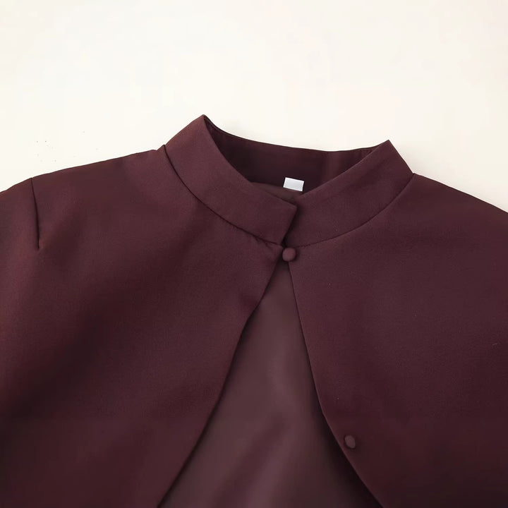 Women’s top with capelet overlay and fitted peplum silhouette Mune Fashion